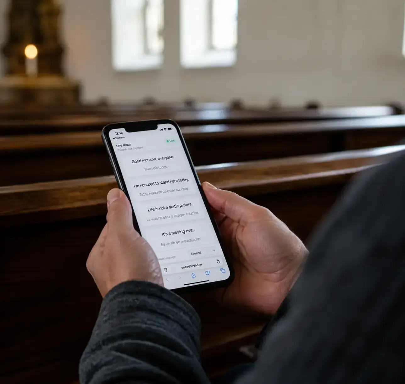 A church guest reading live translation on a phone